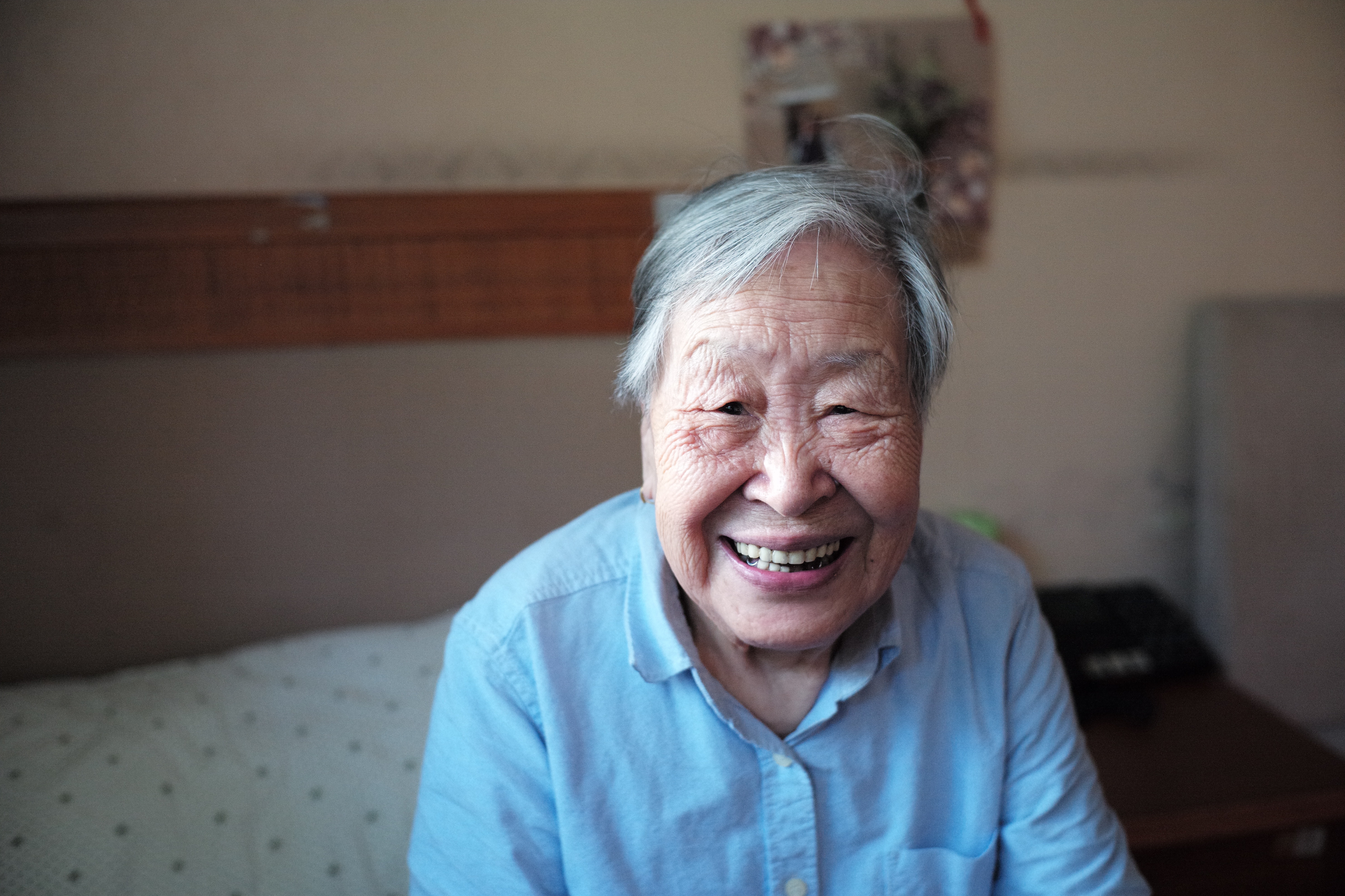 Senior woman sitting on bed