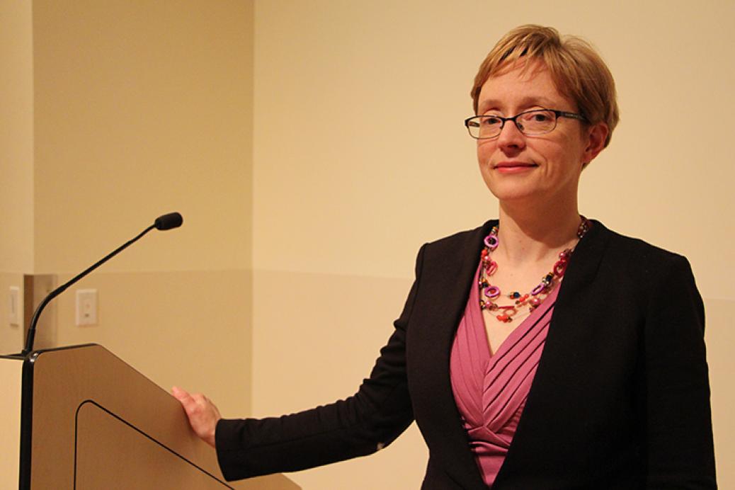 woman standing behind podium