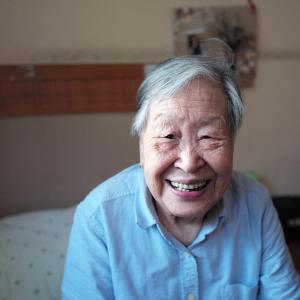 Senior woman sitting on bed