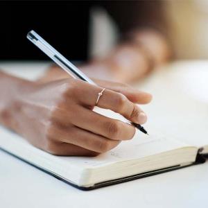 Person writing in a journal