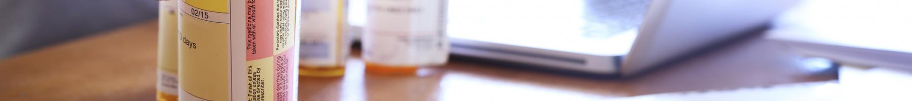 man reading label on prescription bottle